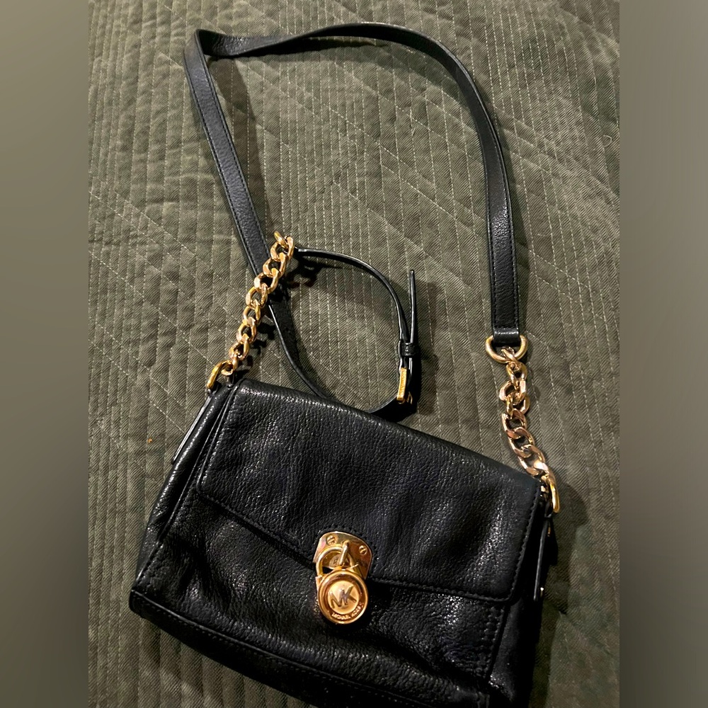 Gold and black Michael Kors crossbody bag